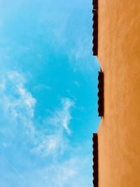Low angle view of building against blue sky
