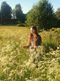 Outdoors sitting on grassy field