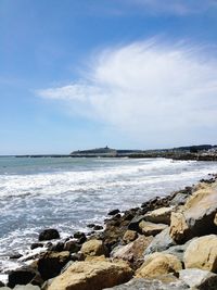 Scenic view of sea against cloudy sky