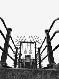 Low angle view of metal structure against clear sky