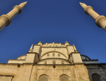 Low angle view of building against clear blue sky