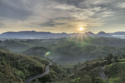 Scenic view of landscape against sky during sunset