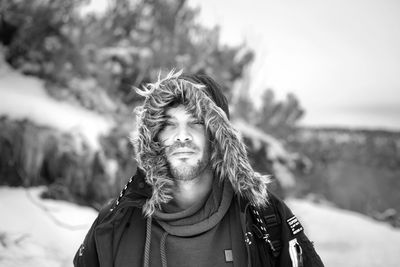 Close-up portrait of a man in snow