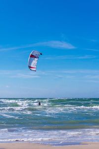 People surfing on beach