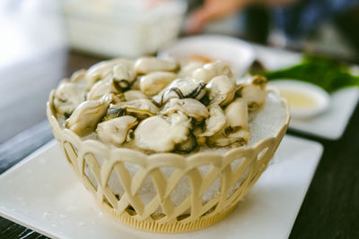 Oysters on the bowl and side dishes.