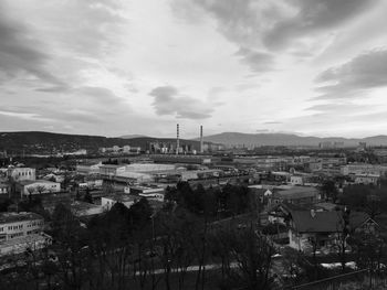 High angle view of town against cloudy sky