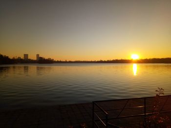 Scenic view of lake against sky during sunset