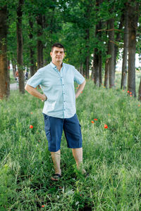 Portrait of man standing on field