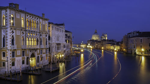 Illuminated buildings in city at night