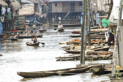 Boats in canal along buildings