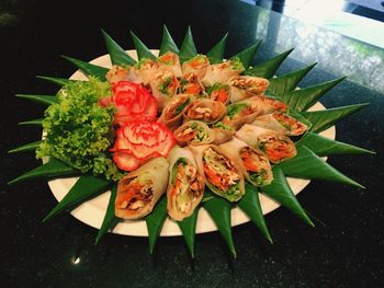 High angle view of flowers in plate on table