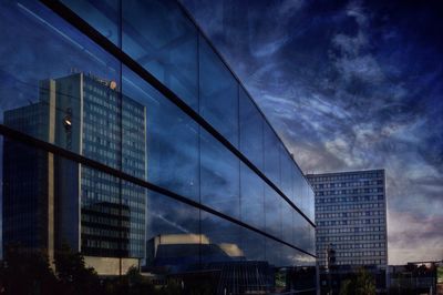 Low angle view of modern building against sky