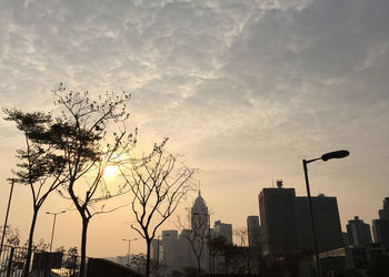 Low angle view of buildings against sky at sunset