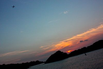 Scenic view of sea against sky at sunset