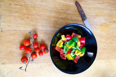 High angle view of chopped fruits in bowl on table
