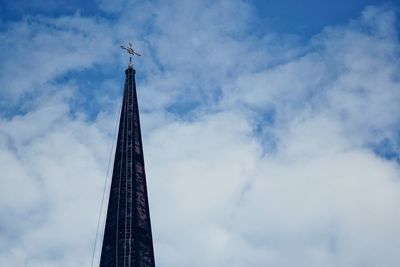 Low angle view of building against cloudy sky