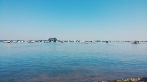 Scenic view of calm sea against clear sky