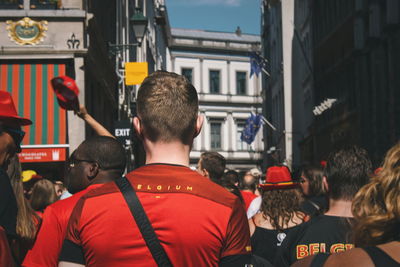 Rear view of people on city street