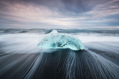 Scenic view of frozen sea against sky