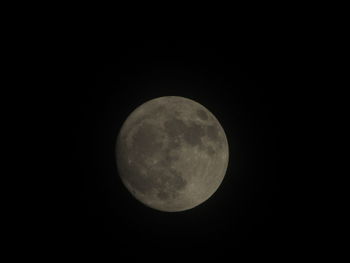 Low angle view of moon against clear sky at night