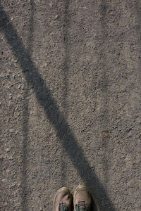 Directly above shot of shoes on road