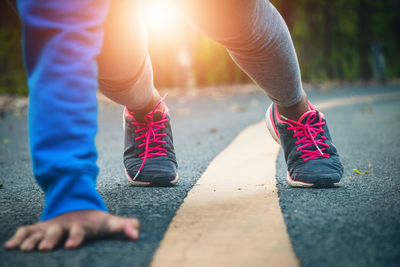 Athlete exercising on road