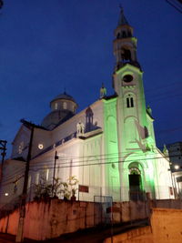 Low angle view of illuminated cathedral against sky