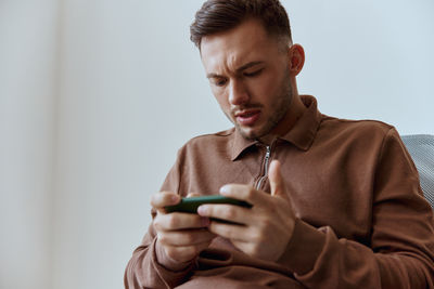 Young man using mobile phone