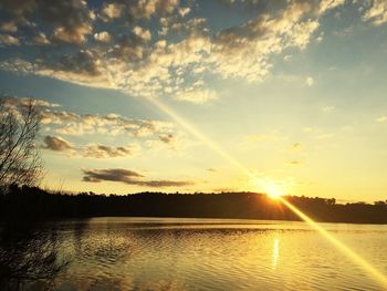 Sunbeam falling on lake during sunset
