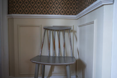 Empty chair in room at home
