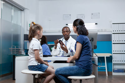 Doctor consulting patient in hospital