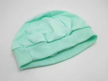 High angle view of green fabric against white background