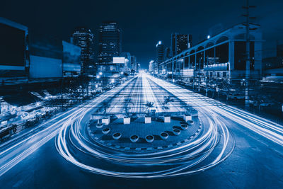 High angle view of light trails on highway at night