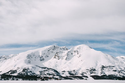 Scenic view of snowcapped mountains against sky