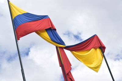 Low angle view of flag against sky