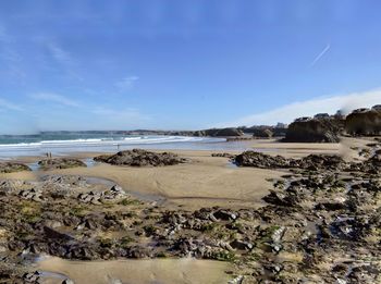 Scenic view of beach against sky