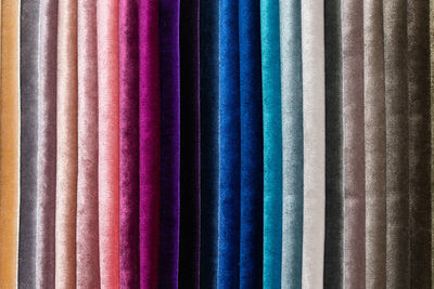 Catalog of multi-colored fabric samples. textile industry background. colored cotton fabric. palet