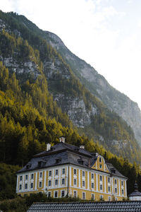 Houses and mountains against sky