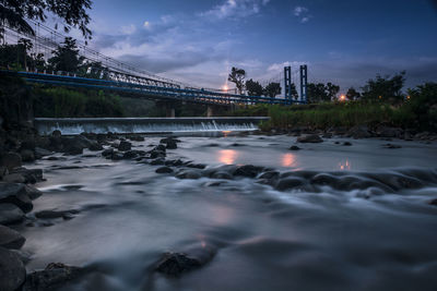 Bridge over river against sky