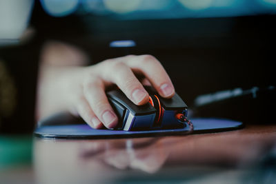 Close up of woman using computer mouse