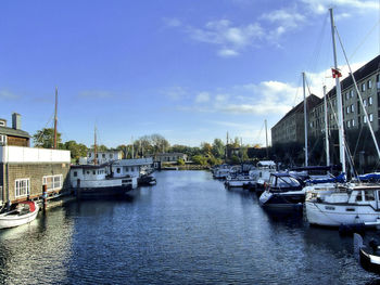 Boats moored at harbor