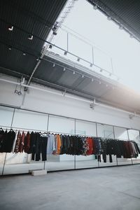 Low angle view of clothes hanging at store