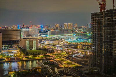 High angle view of illuminated buildings in city at night