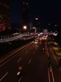 High angle view of illuminated city street at night