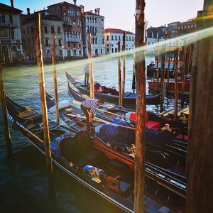 Boats moored in canal