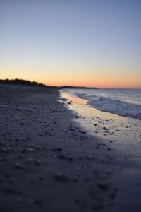 Scenic view of beach against clear sky