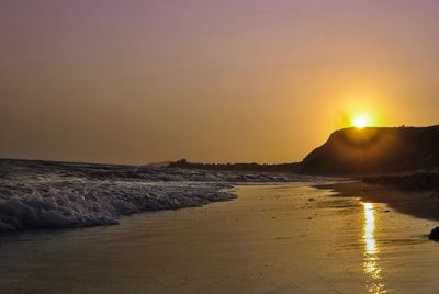 Scenic view of sea against clear sky during sunset