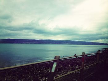 Scenic view of sea against cloudy sky