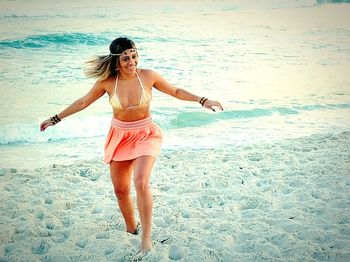 Woman standing on beach