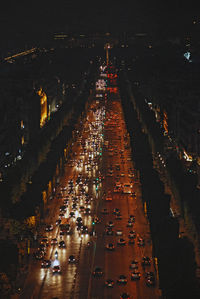 High angle view of city lit up at night